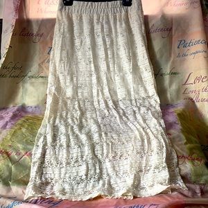 Beautiful long skirt. Half covered and half see through. Color cream.